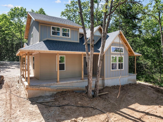 111 Ironwood St, Shell Knob, MO 65747 - view of front of house featuring covered porch, roof with shingles, and board and batten siding