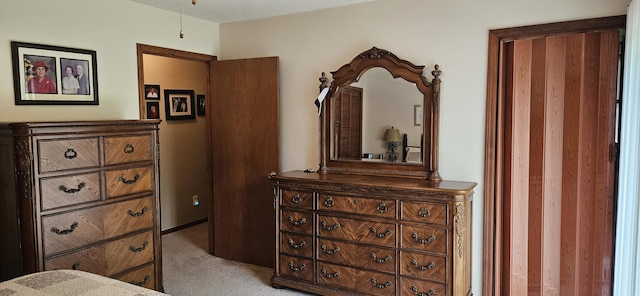 bedroom featuring light carpet