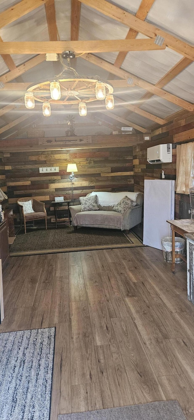 interior space with hardwood / wood-style flooring, a wall mounted air conditioner, and lofted ceiling