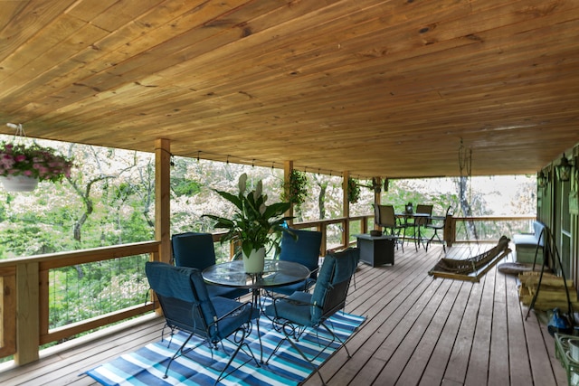 wooden deck featuring outdoor dining area