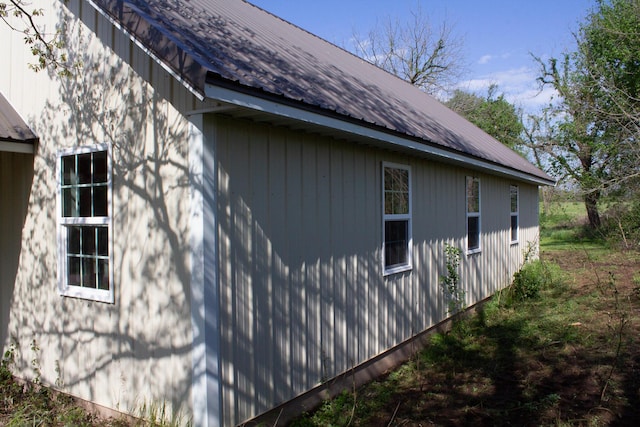 view of property exterior with metal roof