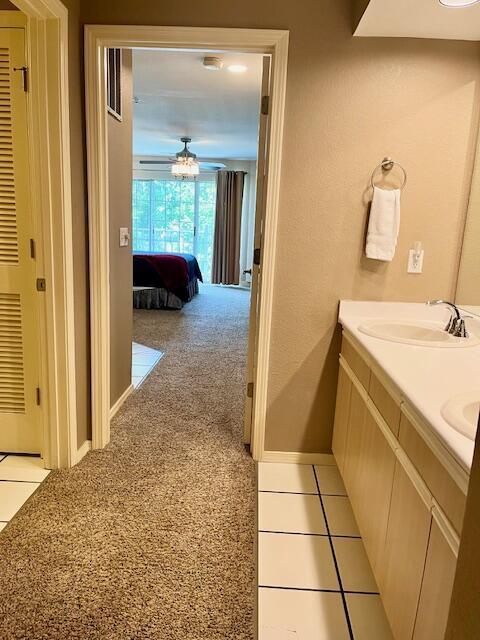 530 Spring Creek Ct Unit 7, Branson, MO 65616 - bathroom with double vanity and baseboards
