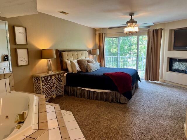 530 Spring Creek Ct Unit 7, Branson, MO 65616 - carpeted bedroom featuring access to outside