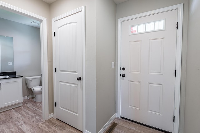 2632 N Prospect Ave, Springfield, MO 65803 - foyer with baseboards, visible vents, and light wood-style floors
