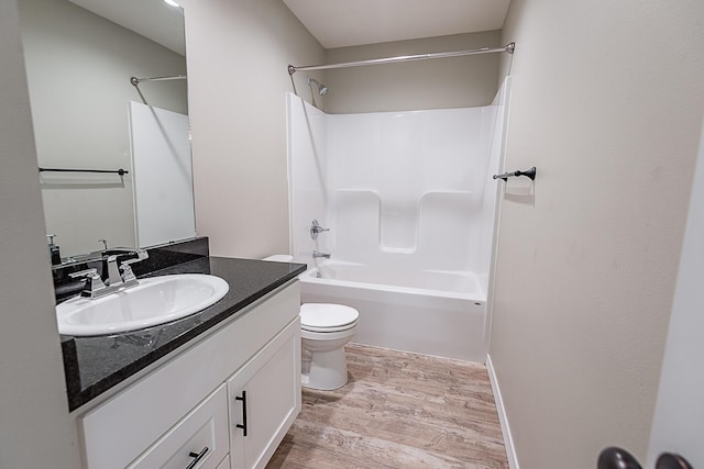 2632 N Prospect Ave, Springfield, MO 65803 - full bath with vanity, tub / shower combination, wood finished floors, and toilet