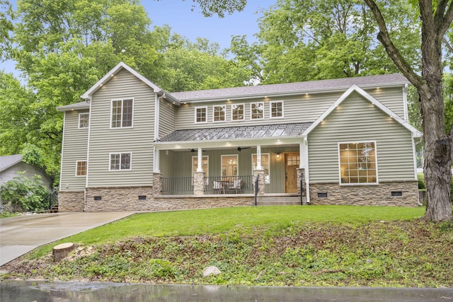 view of front facade with covered porch, a front lawn, and crawl space