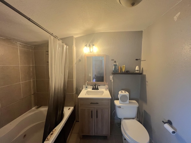 full bath with vanity, a textured wall, toilet, a textured ceiling, and shower / tub combo