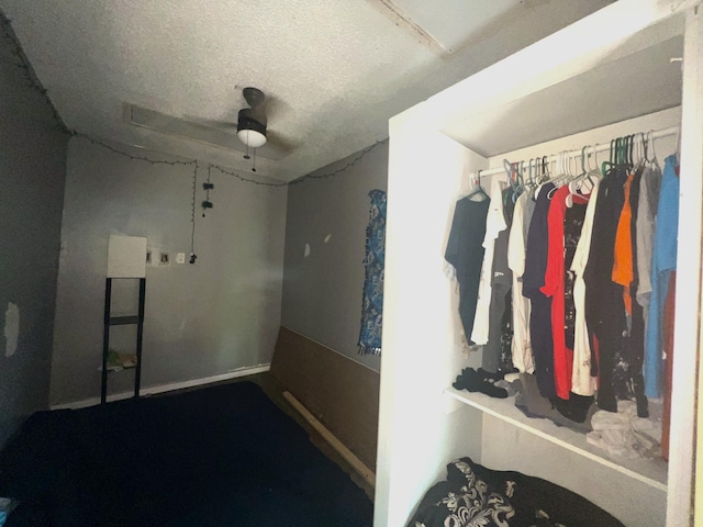 interior space with ceiling fan