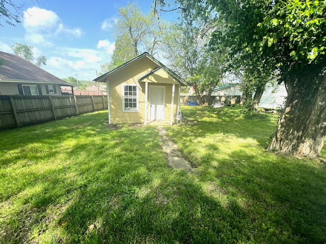 view of outbuilding featuring a fenced backyard and an outdoor structure
