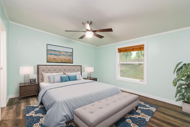 bedroom featuring baseboards, ornamental molding, and wood finished floors