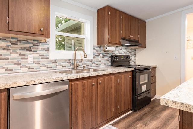 kitchen featuring a sink, dark wood finished floors, black electric range oven, stainless steel dishwasher, and under cabinet range hood