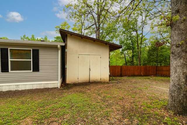 view of shed with fence