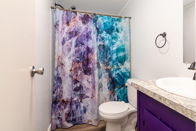 full bathroom featuring wood finished floors, toilet, curtained shower, and vanity