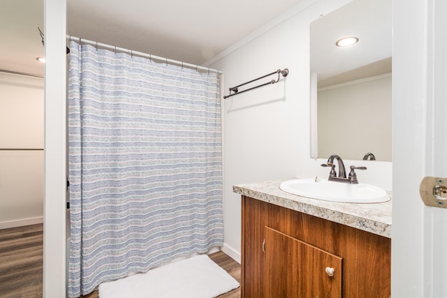 bathroom with crown molding, wood finished floors, vanity, recessed lighting, and a shower with shower curtain