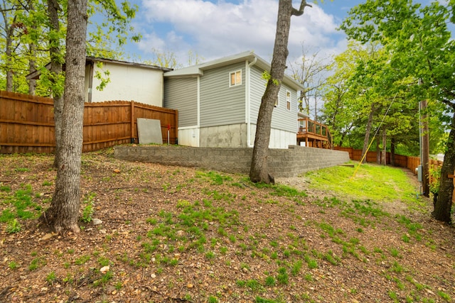 view of property exterior with fence