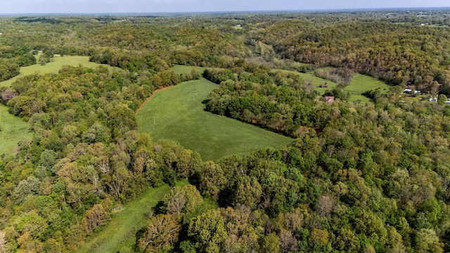 drone / aerial view featuring a view of trees