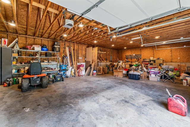 garage featuring a workshop area and a garage door opener