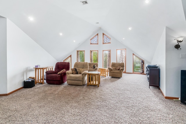 carpeted living area featuring baseboards, visible vents, recessed lighting, and lofted ceiling