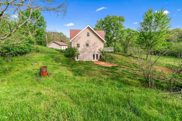 view of yard with french doors