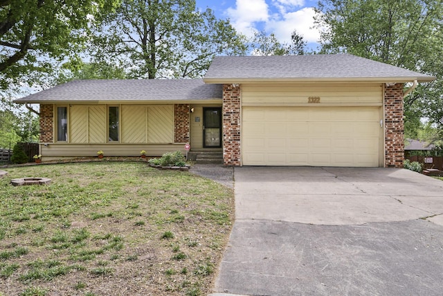 view of front of house with brick siding, an attached garage, driveway, and roof with shingles