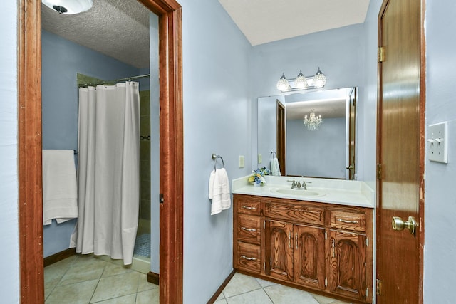 full bathroom with tile patterned flooring, baseboards, a shower with shower curtain, and vanity