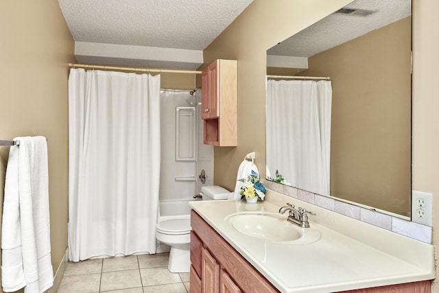 full bathroom featuring a textured ceiling, visible vents, tile patterned floors, vanity, and toilet
