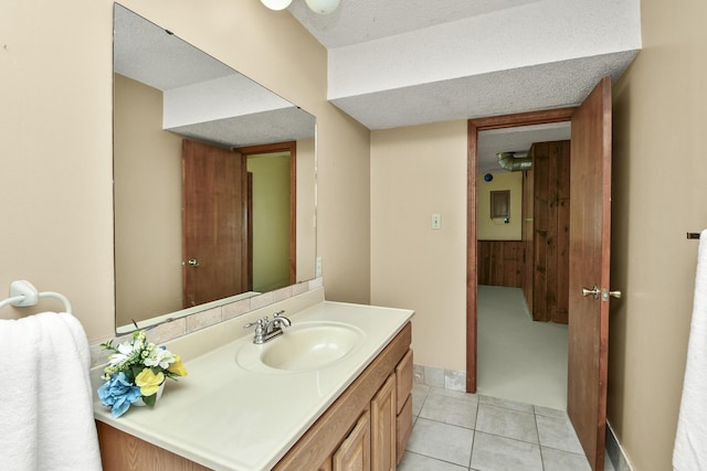 bathroom with tile patterned floors and vanity