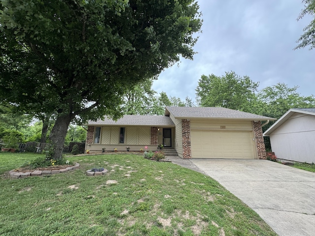 1322 S Sieger Dr, Springfield, MO 65804 - view of front facade featuring an attached garage, brick siding, driveway, and a front yard