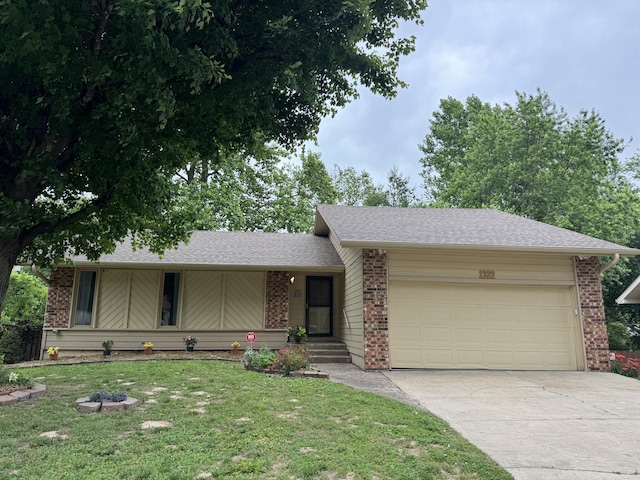 1322 S Sieger Dr, Springfield, MO 65804 - view of front of property featuring a garage, concrete driveway, a front yard, brick siding, and roof with shingles