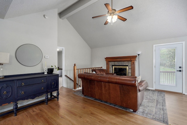 523 E Camino St, Springfield, MO 65810 - living room featuring wood finished floors, beam ceiling, a fireplace, high vaulted ceiling, and a ceiling fan