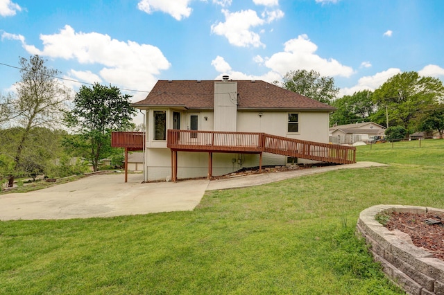523 E Camino St, Springfield, MO 65810 - back of property with a lawn, roof with shingles, a wooden deck, and a chimney