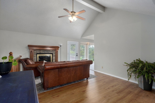 523 E Camino St, Springfield, MO 65810 - living room with wood finished floors, beam ceiling, a fireplace, baseboards, and a ceiling fan