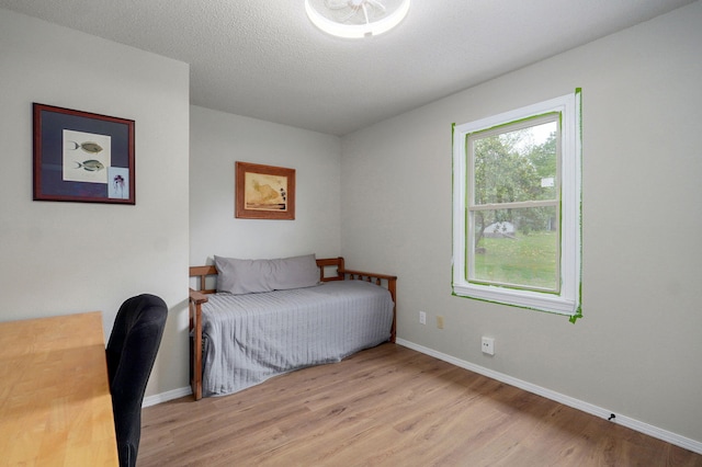 523 E Camino St, Springfield, MO 65810 - bedroom featuring baseboards and light wood finished floors