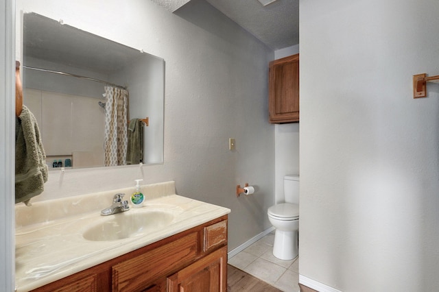 523 E Camino St, Springfield, MO 65810 - bathroom with curtained shower, baseboards, tile patterned floors, vanity, and toilet
