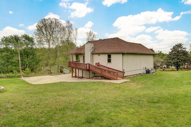 523 E Camino St, Springfield, MO 65810 - rear view of house featuring stairway, central AC unit, a chimney, a patio area, and a yard