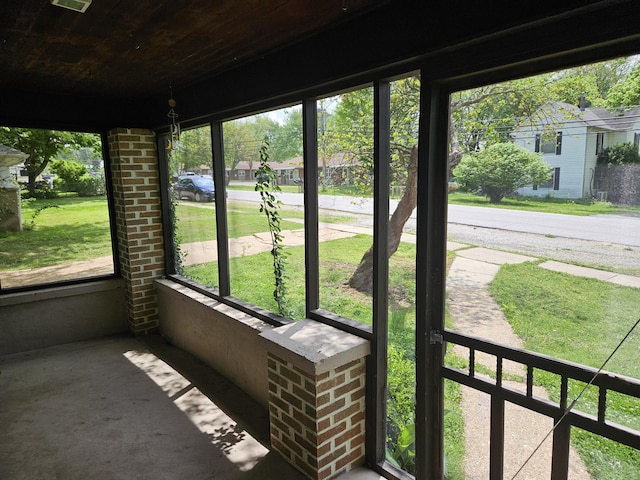 unfurnished sunroom with a wealth of natural light