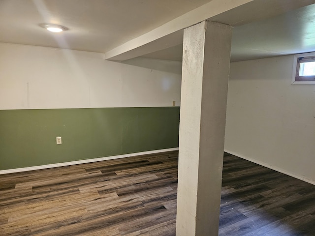below grade area with baseboards and wood finished floors