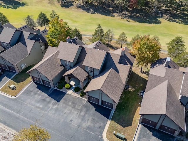 drone / aerial view with a residential view and golf course view