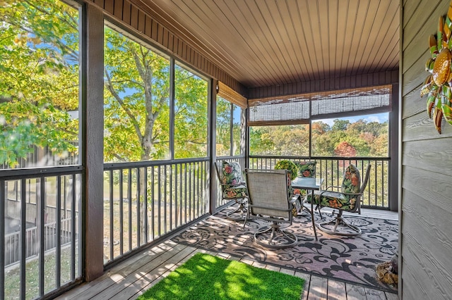 sunroom / solarium with outdoor dining space