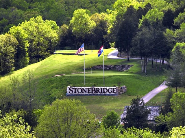 birds eye view of property with a forest view