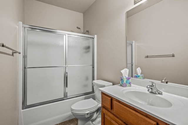 full bathroom with toilet, bath / shower combo with glass door, and vanity