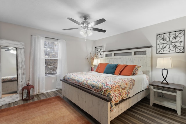 bedroom featuring baseboards, ceiling fan, and wood finished floors