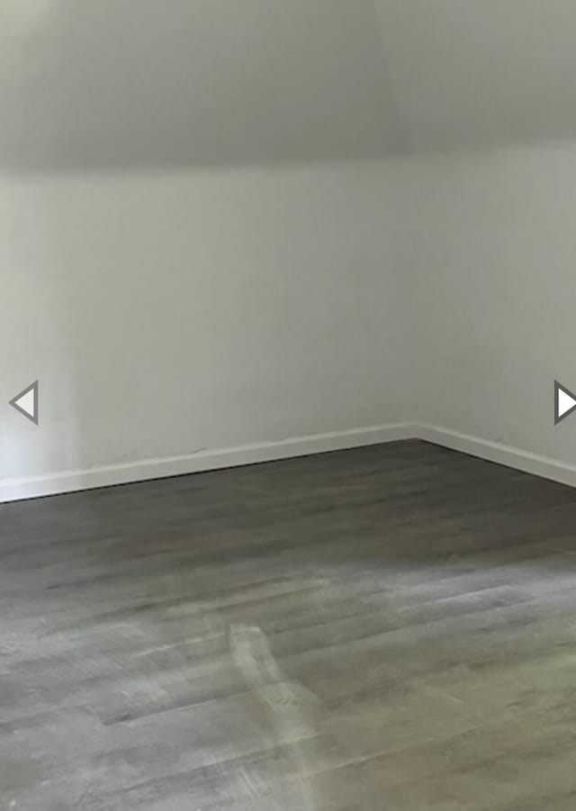 unfurnished room featuring baseboards