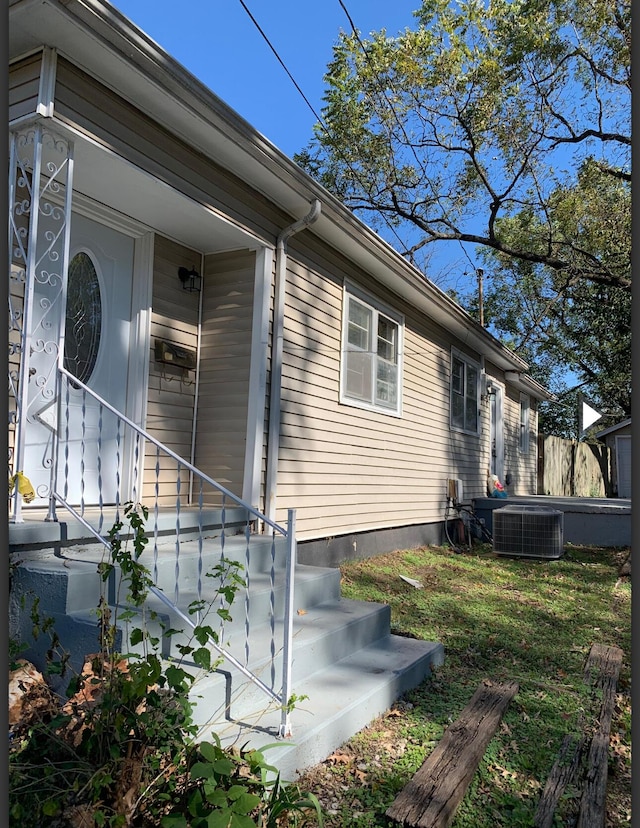 view of property exterior with cooling unit