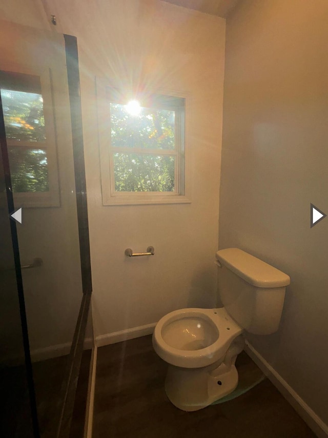 1327 W Livingston St, Springfield, MO 65803 - bathroom featuring baseboards and toilet