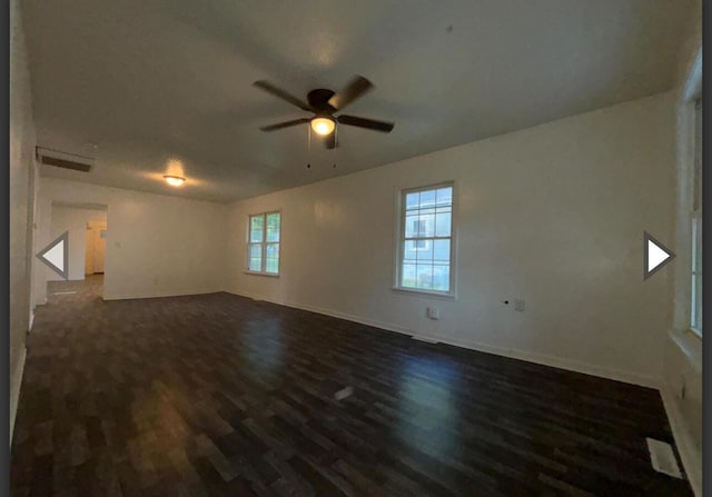 1327 W Livingston St, Springfield, MO 65803 - empty room featuring visible vents, a ceiling fan, dark wood finished floors, and baseboards