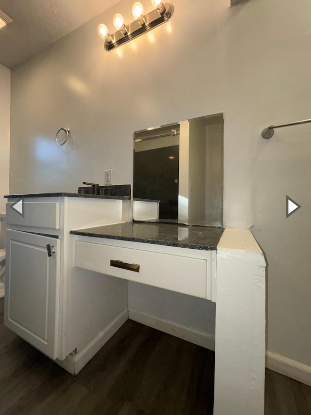 1327 W Livingston St, Springfield, MO 65803 - bathroom with baseboards and wood finished floors