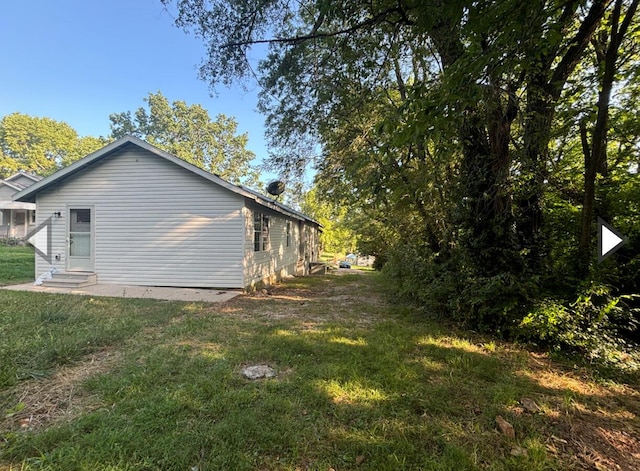1327 W Livingston St, Springfield, MO 65803 - view of side of property with a lawn and entry steps