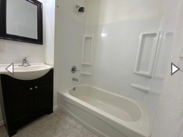 full bathroom with tile patterned floors, shower / washtub combination, and vanity