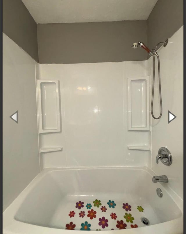 bathroom featuring washtub / shower combination